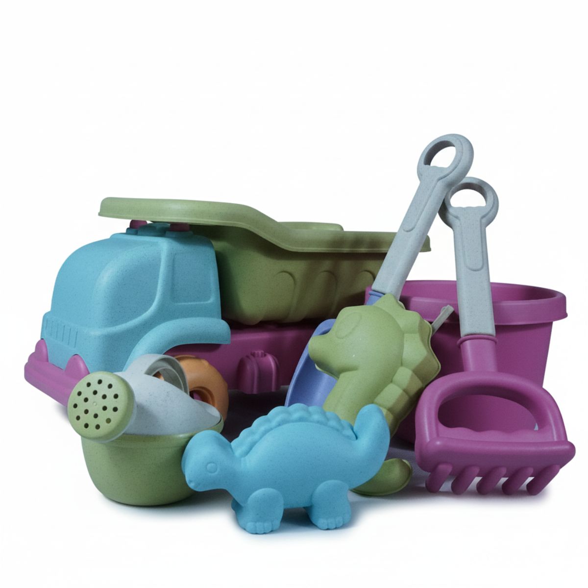 A colorful children's beach toy set featuring a blue and green dump truck, a purple bucket, a shovel, a rake, a watering can, and two dinosaur sand molds.