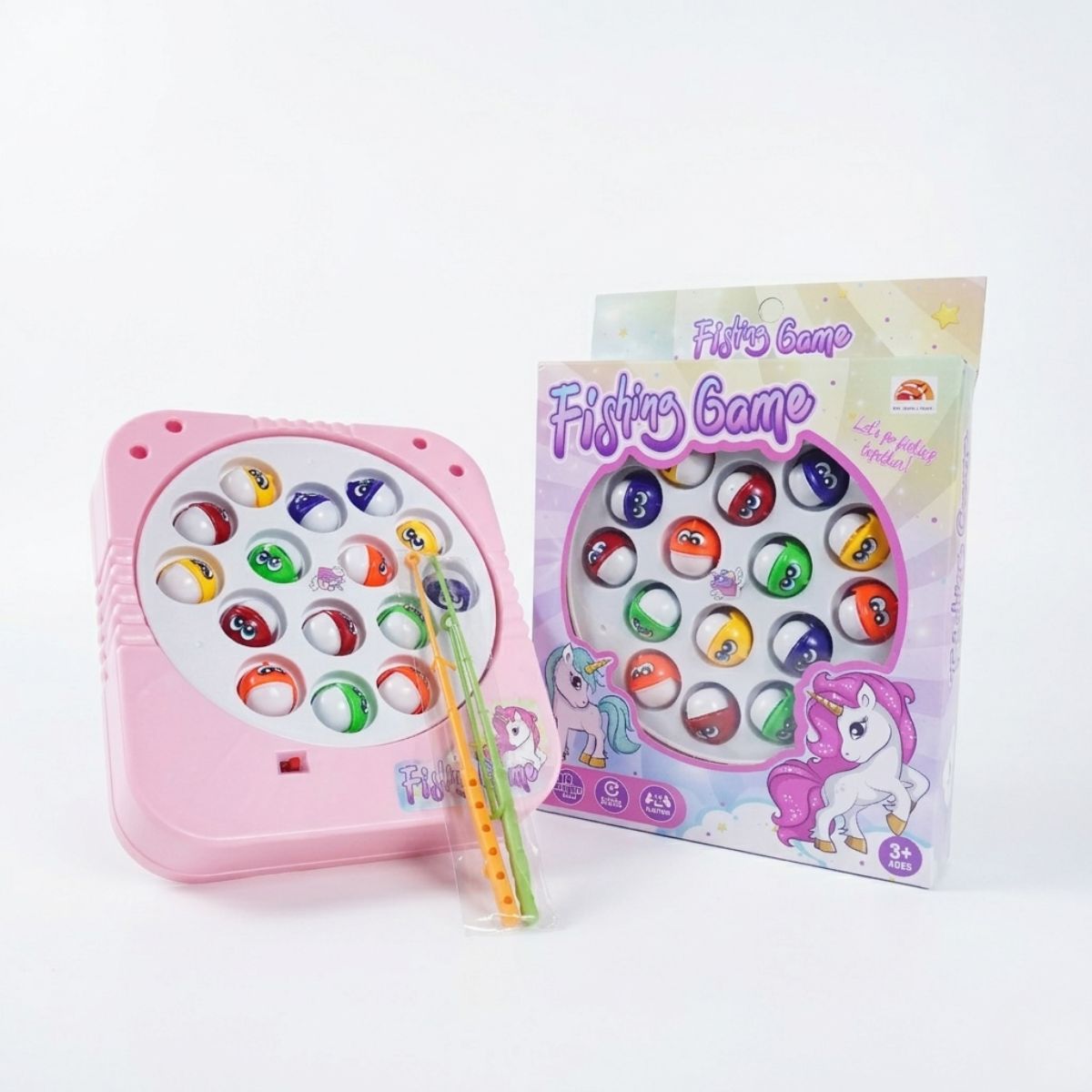 A pink unicorn-themed electric rotating fishing game toy with 15 colorful round fish, two fishing rods, and its original packaging box.
