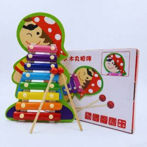 A wooden 8-note xylophone toy shaped like a pirate with colorful metal keys and two wooden mallets, displayed next to its packaging.